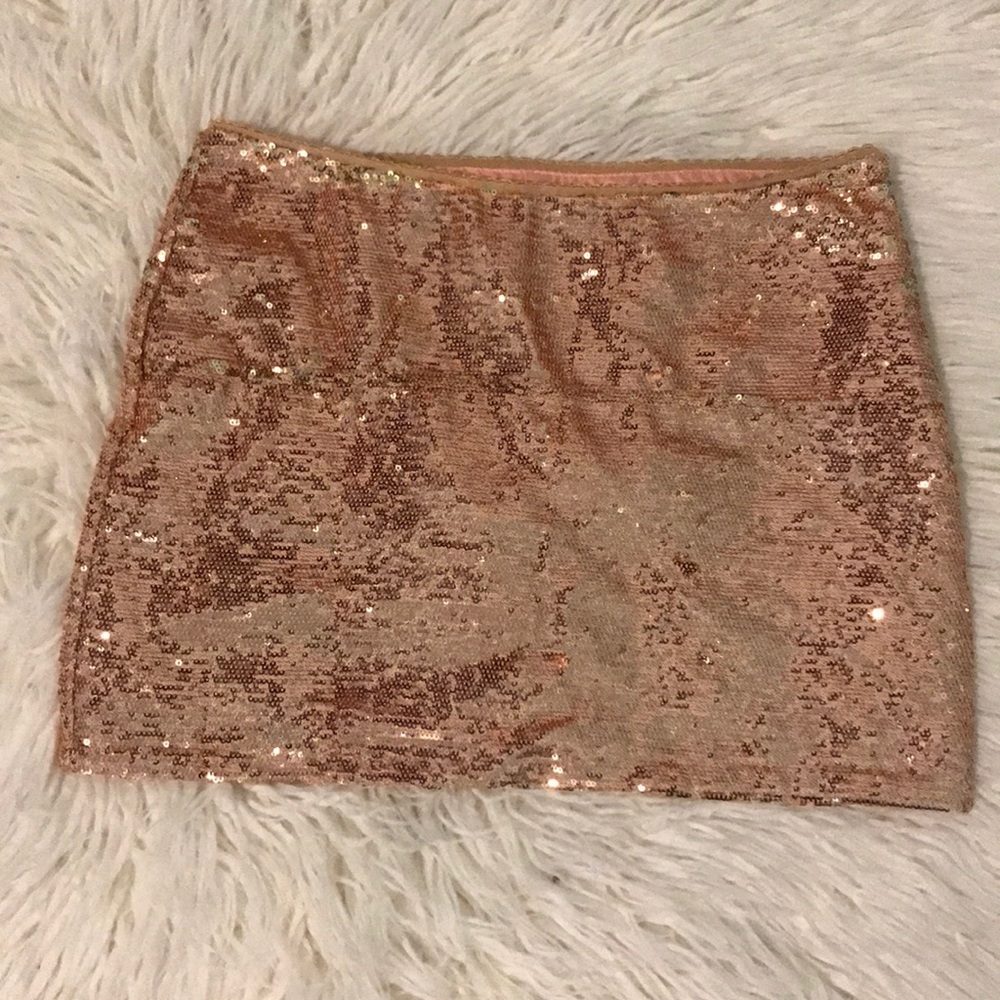 Forever 21 size small. Pink sequin mini skirt.